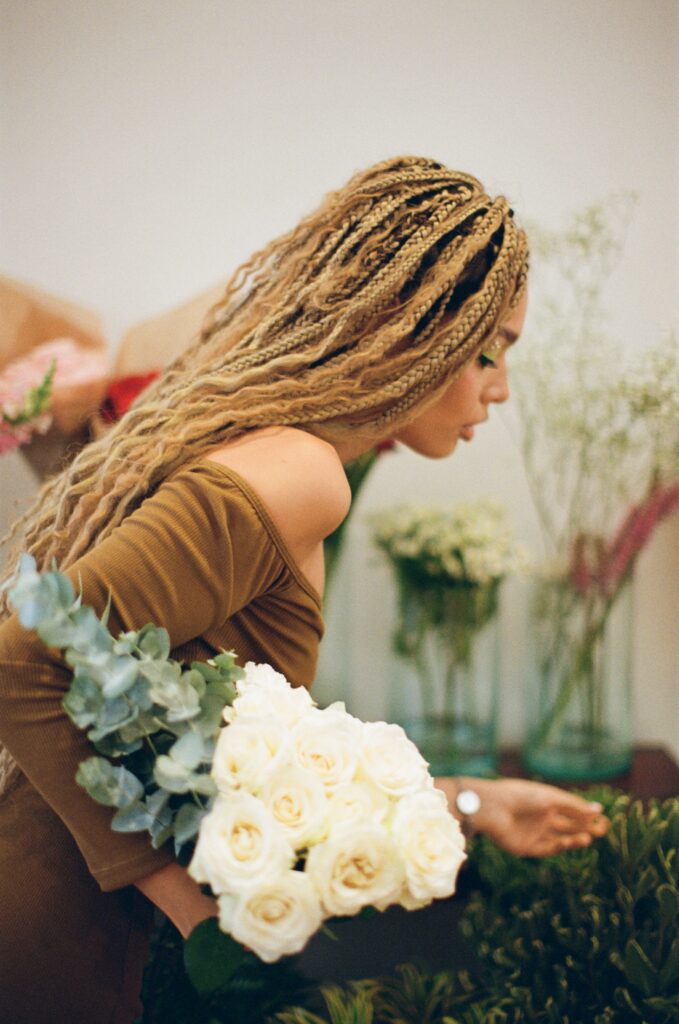 Image of a customer picking her daily flowers at ROU cafe.